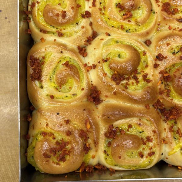 Fresh baked garlic pesto bread rolls from Crème It Up